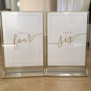 Clear/ gold acrylic frames with w/ table numbers